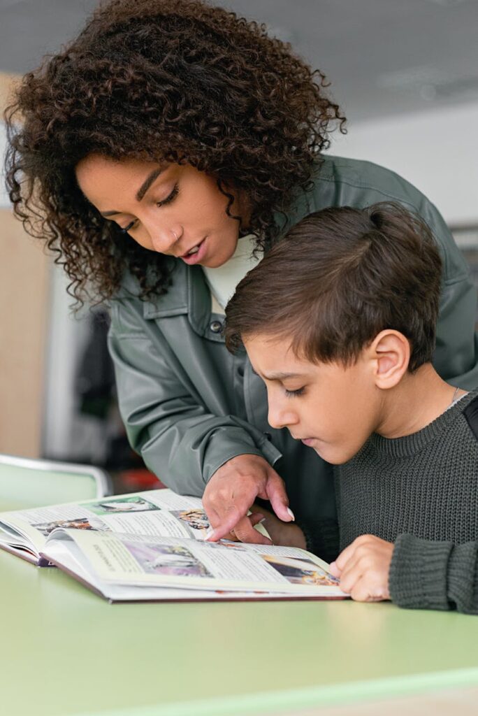 woman and a boy reading a book